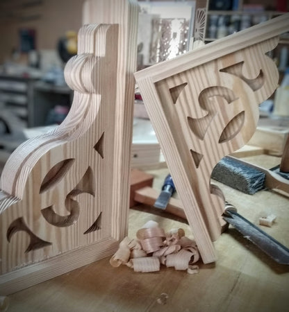 A pair of wooden corbels